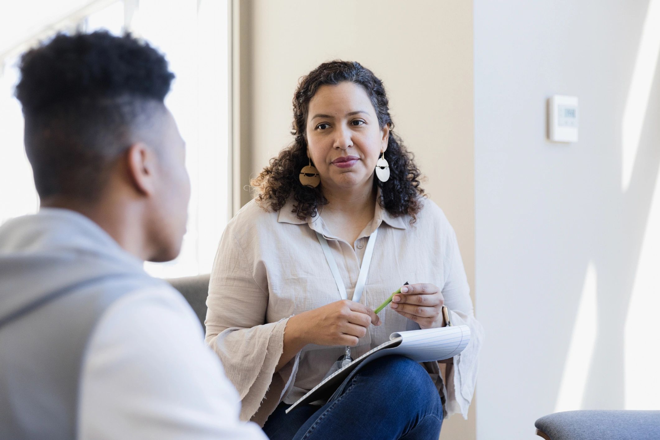Counselor listening attentively during a confidential session