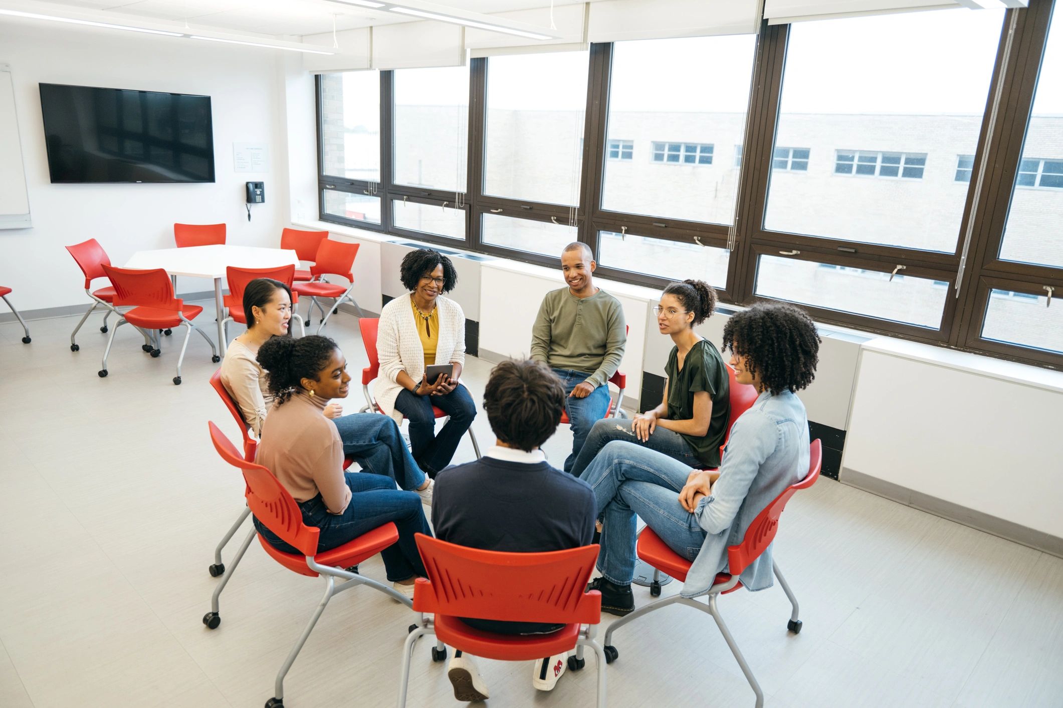 Support group in a circle during a facilitated discussion